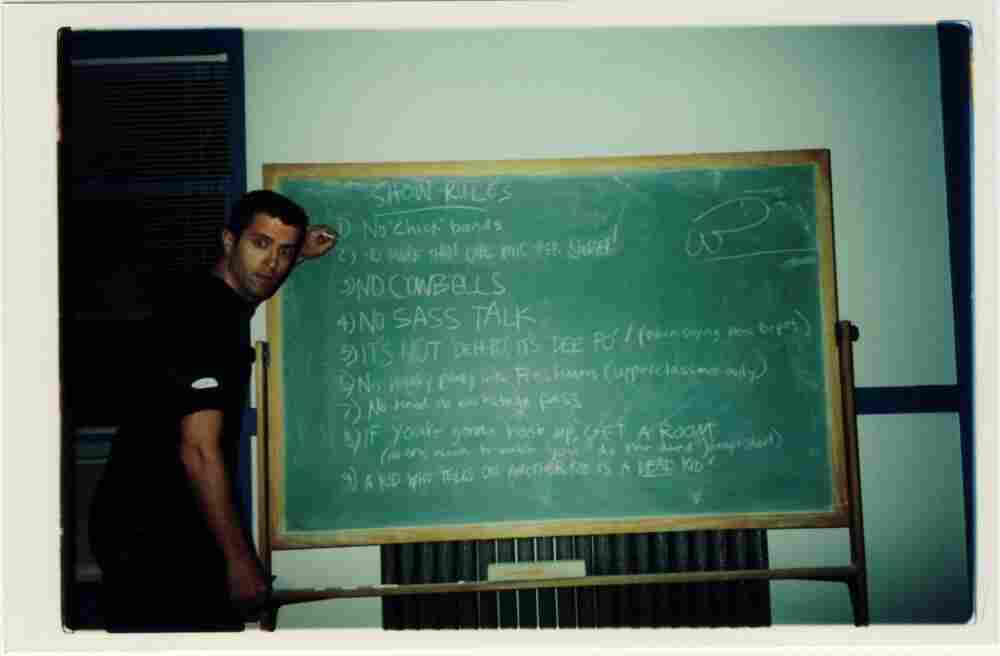 photo of a chalk board with funny rules for rock bands
